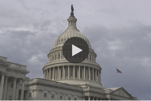 Image of capitol with play button